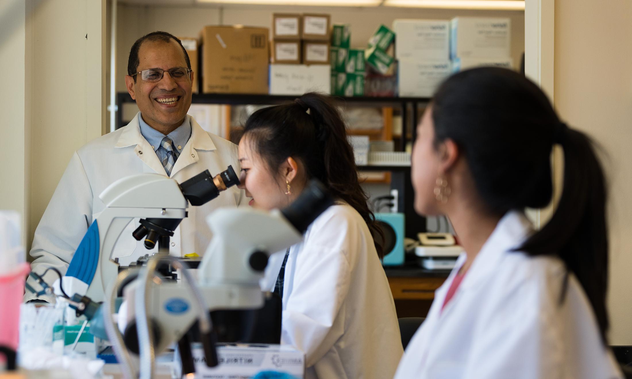 An image of Dr. Al-Shawbrawey with students