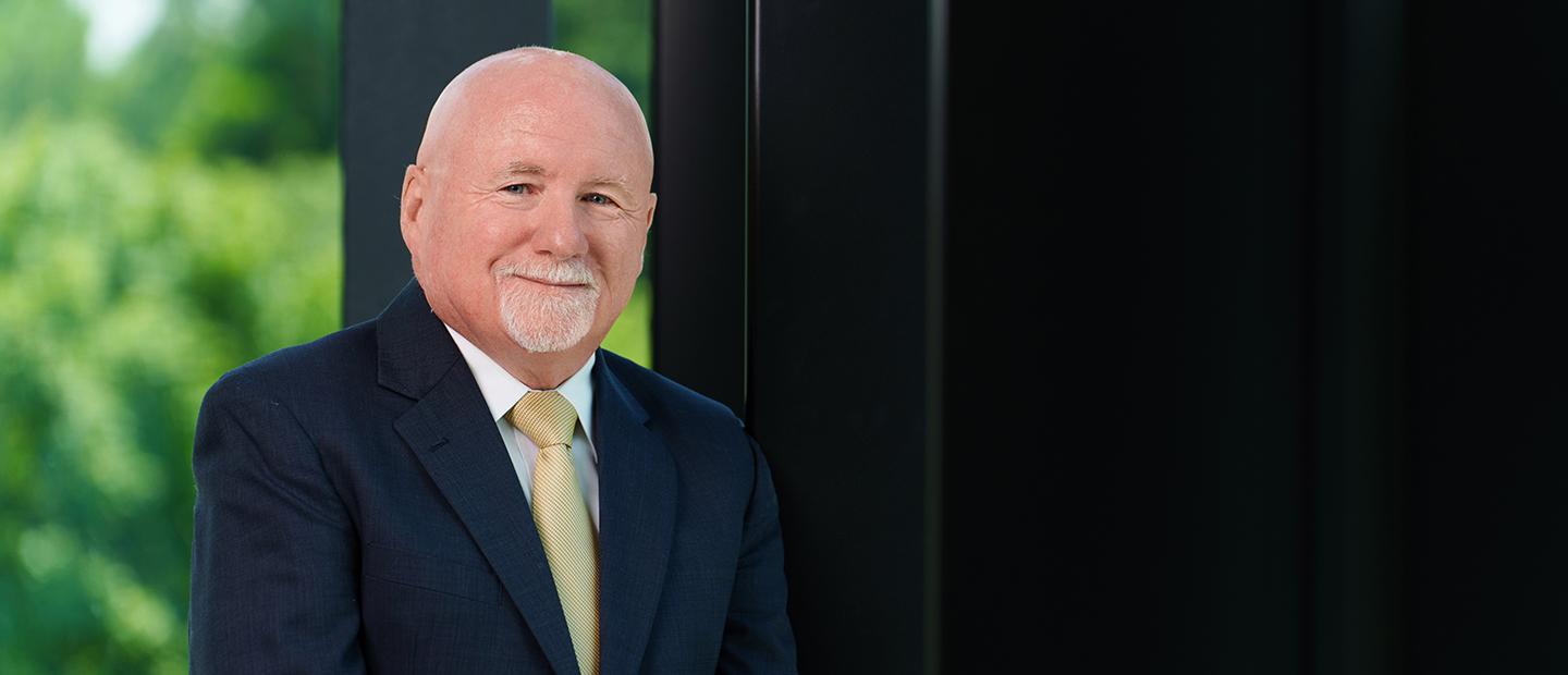 Oakland University Provost, Dr. Kevin Corcoran, smiling at the camera.